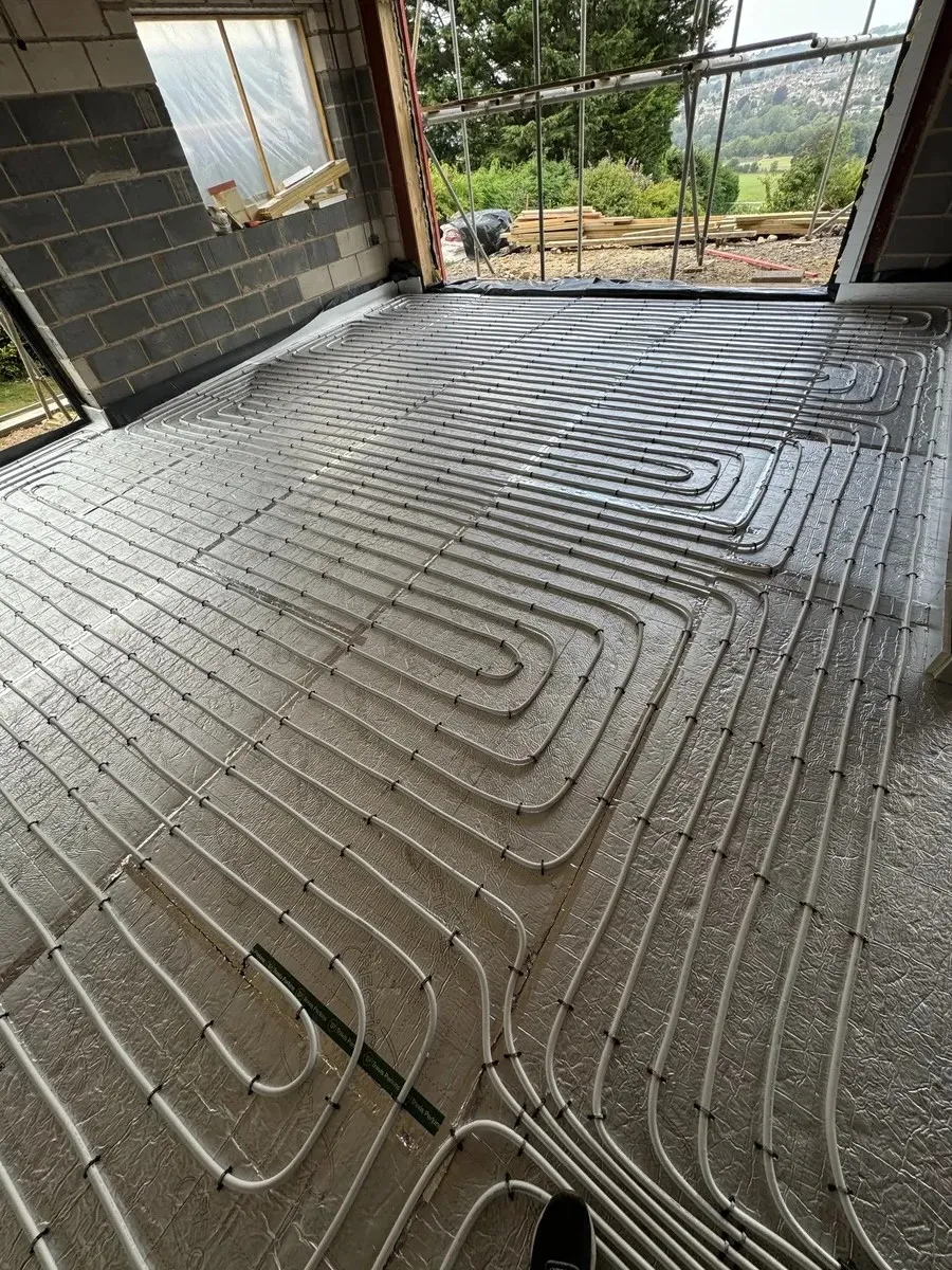 white underfloor heating pipes on building site