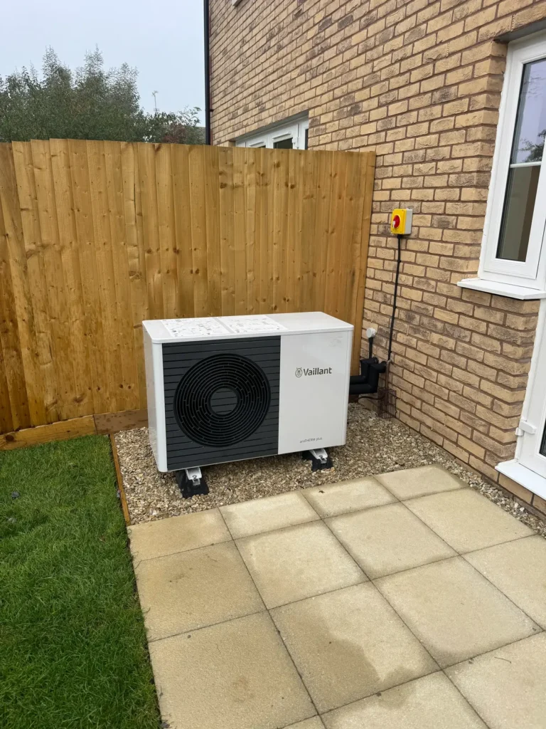 small Air source heat pump in cheltenham garden