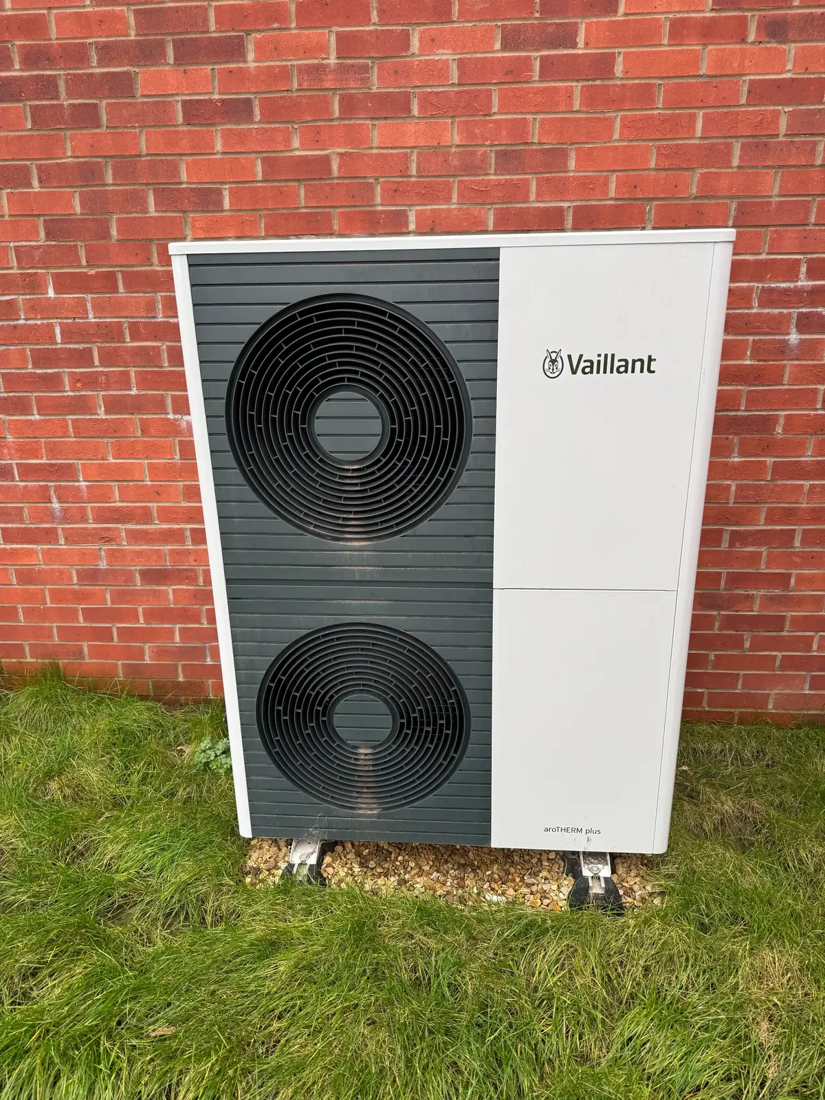 tall air source heat pump in a Cheltenham garden